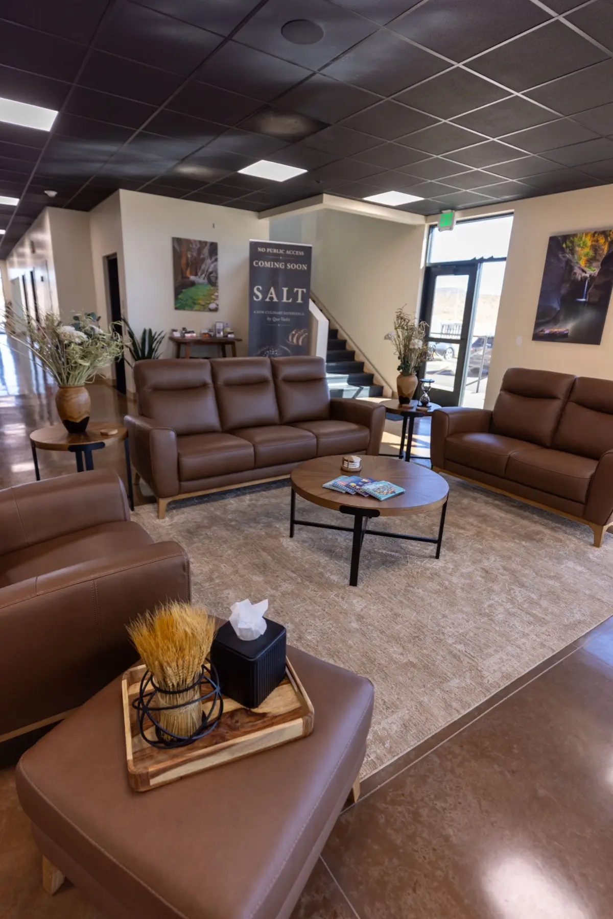 Passenger lounge with leather seating at Sandstone Aviation.