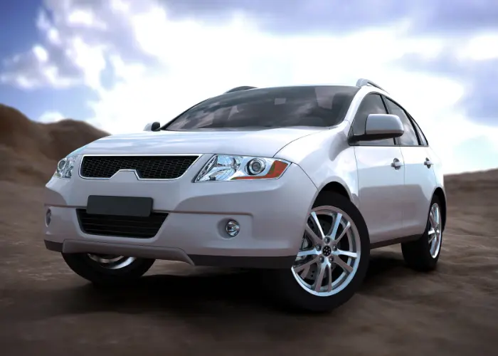 White rental vehicle against a desert-style background